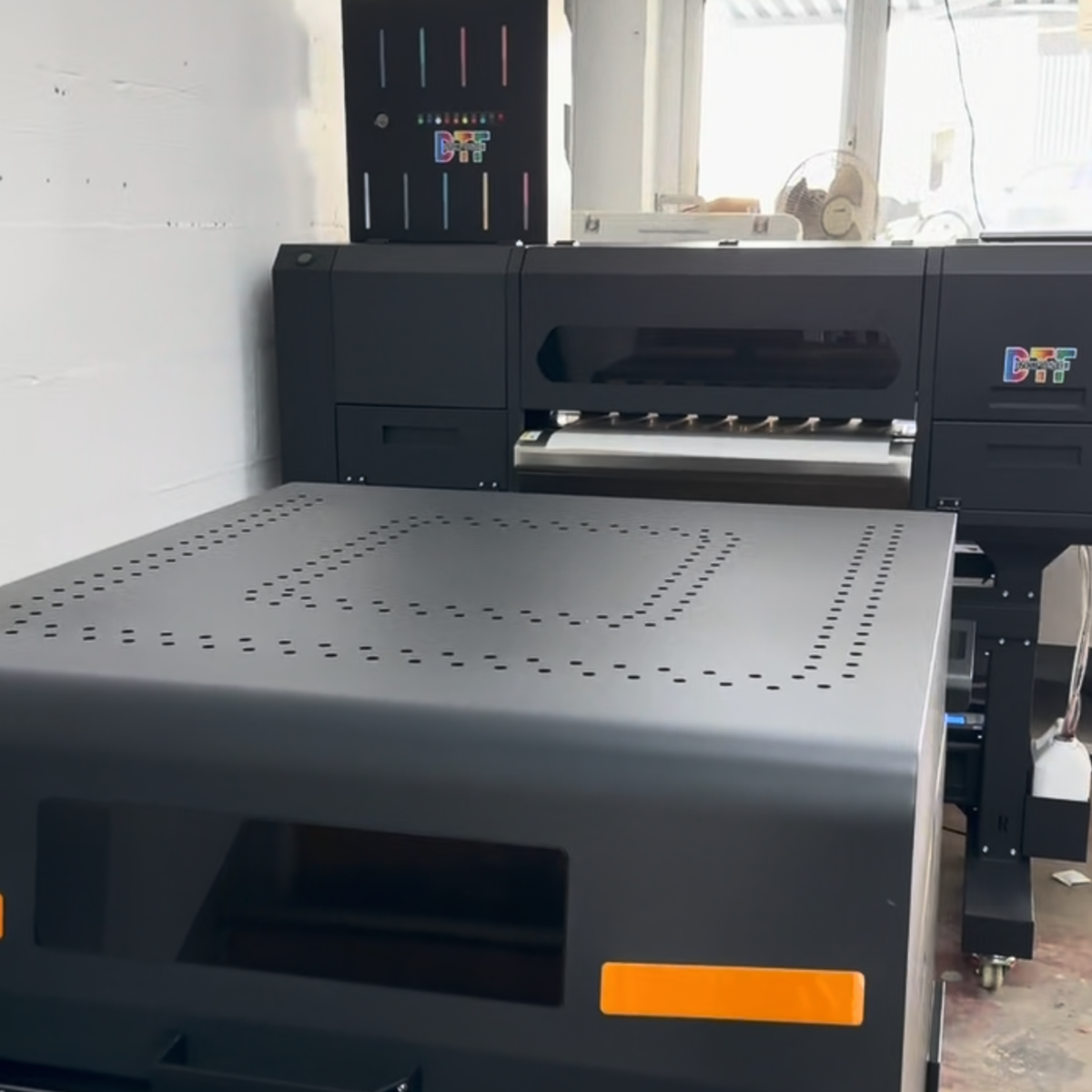 9-colour DTF printing machine used to produce custom DTF transfers and gang sheets